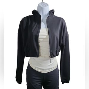 Meshki Crop Zip Hoodie Has elastic waist and sleeves